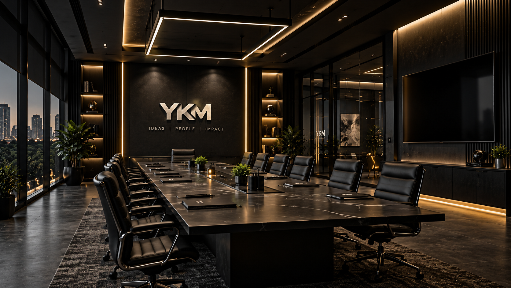 YKM leadership team boardroom — Yuvaraj Kumar M, Shyaam M, Amrita Rao